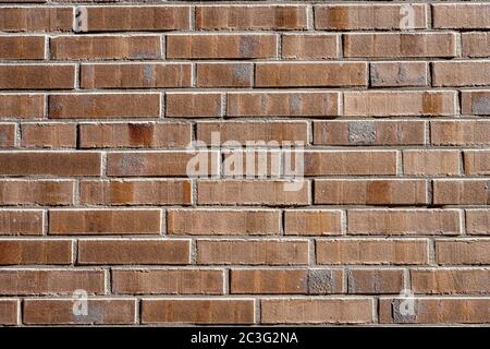 Sfondo da una parete fatta di mattoni marroni Foto Stock