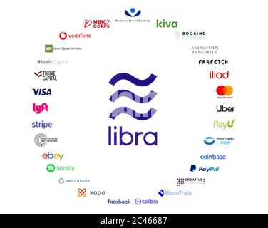 Kiev, Ucraina - 19 giugno 2019: Logo di Libra e 27 organizzazioni associative stampati su carta. Libra è una proposta di CURRE virtuale di blockchain Foto Stock
