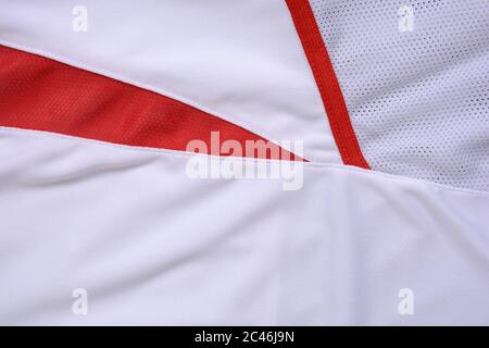 Tessuto in Jersey rosso e bianco, sfondo sportivo. Foto Stock