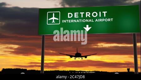 Atterraggio di silhouette di aeroplano a Detroit, Metro, DTW, Michigan, Stati Uniti. Arrivo in città con cartello con la direzione dell'aeroporto e tramonto sullo sfondo. T Foto Stock