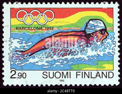 FINLANDIA - CIRCA 1992: Un francobollo stampato in Finlandia dal numero 'Giochi Olimpici di Barcellona' mostra il nuoto, circa 1992. Foto Stock