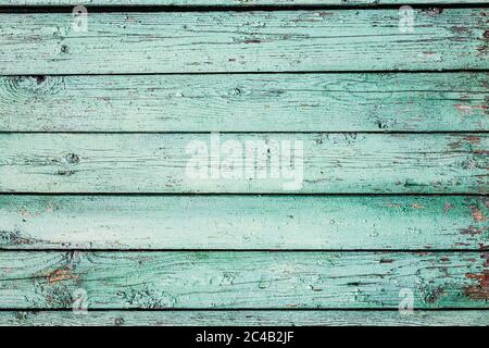 Una vecchia struttura di legno orizzontale verniciata di verde chiaro Foto Stock