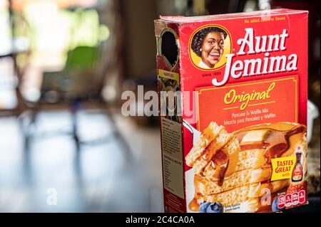Icona donna nera usata per promuovere un cibo da cucina. Foto Stock