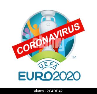 Kiev, Ucraina - 20 marzo 2020: 2020 Campionato europeo UEFA stampato su carta, attraversato da cartello cartaceo Coronavirus. Il campionato è stato rinviato Foto Stock