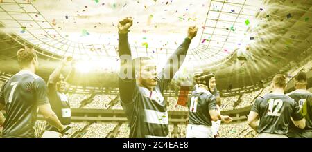 Immagine digitale composita della squadra di rugby che celebra una vittoria nello stadio sportivo Foto Stock