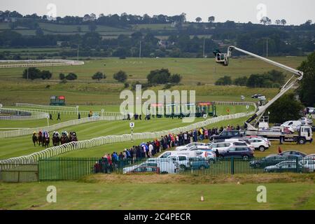 Corridori e piloti nel Paddy Power Rockingham all'ippodromo di Curragh. Foto Stock