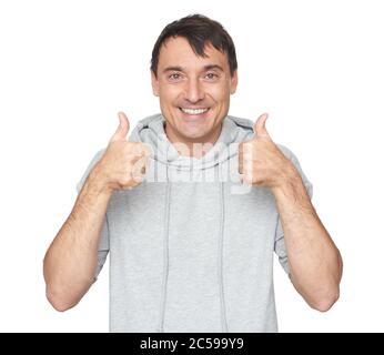 Felice uomo bello che mostra pollice in alto Foto Stock