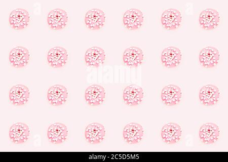 Ripetizione senza giunture. Ciambelle rosa con marshmallow bianco su sfondo rosa. Vista dall'alto, spazio di copia. Foto Stock