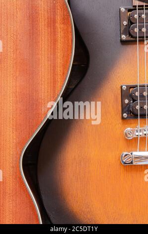 Corpo elettrico della chitarra. Strumento musicale in legno. Dettagli chitarra. Ponte di chitarra con corde. Foto Stock