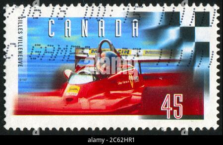 CANADA - CIRCA 1997: Francobollo stampato dal Canada, mostra Gilles Villeneuve (1950-82), Formula uno pilota di auto da corsa, circa 1997 Foto Stock