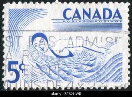 CANADA - CIRCA 1956: Francobollo stampato dal Canada, spettacoli nuotatore, circa 1956 Foto Stock