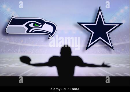 Seattle Seahawks vs Dallas Cowboys. Gioco NFL. Partita della American Football League. Silhouette di giocatore professionista festeggia il tocco in giù. Schermata in backg Foto Stock