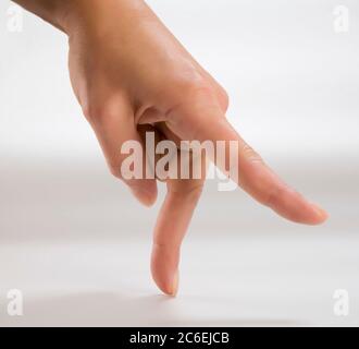 Mano dito che cammina Foto Stock