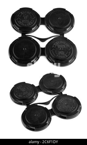 Set di quattro coperchi in plastica collegati per confezione a tazza Foto Stock