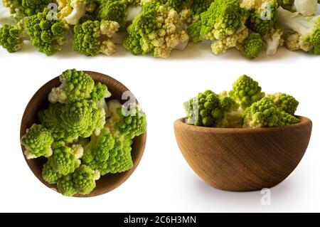 Vista dall'alto. Set di cavolfiori romani. Cavolfiore romano su ciotola di legno isolato su bianco. Primo piano del cavolfiore romano. Struttura frattale di romanesco brocc Foto Stock