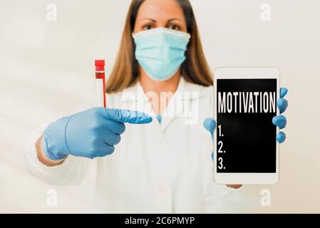 Il cartello di testo indica la motivazione. Motivi del testo della foto di affari uno ha per comportarsi o comportarsi in un modo particolare tecnico di laboratorio che presenta sti vuoto Foto Stock