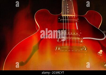 Una chitarra elettrica a corpo semi-holowbody Gibson ES-335 rossa. Foto Stock