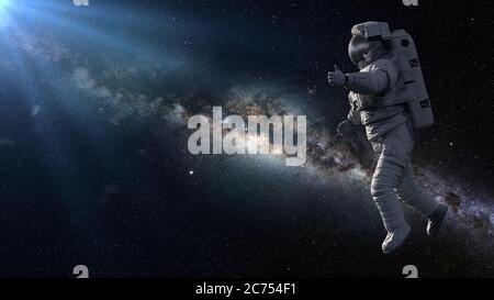 astronauta che mostra i pollici durante la camminata spaziale Foto Stock