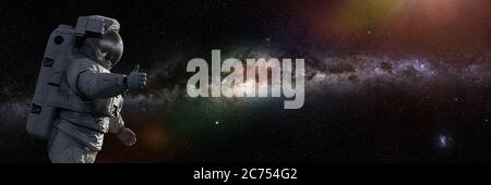 astronauta che mostra i pollici durante la passeggiata spaziale, banner di sfondo Foto Stock