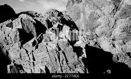 Rocce costiere grigiwacke, Wellington NZ Foto Stock