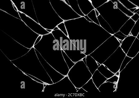 Rughe e crepe di vetro causate da urti e cadute. Isolamento su fondo nero Foto Stock