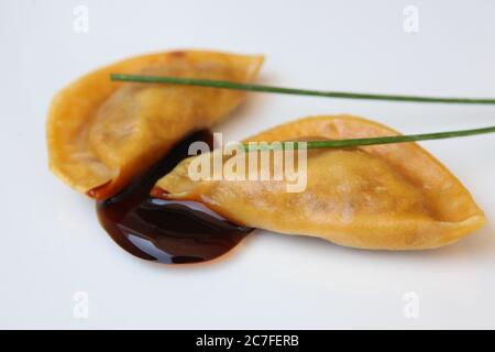 Vaporizzato gyoza (Jiaozi) un cinese gnocco Foto Stock