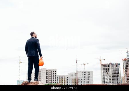 Back view of successful manager looking the construction site Stock Photo