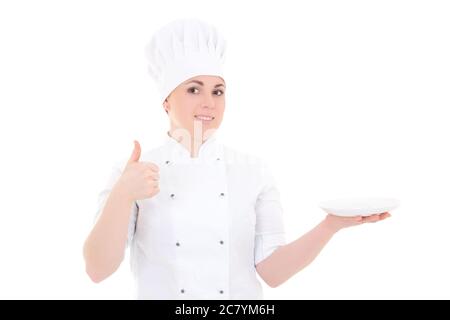 ritratto di giovane cuoca in uniforme con i pollici vuoti della piastra su isolato su sfondo bianco Foto Stock