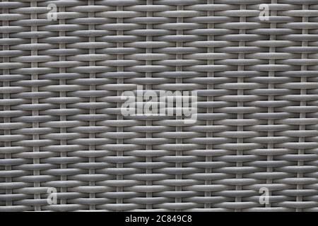 Uno sfondo a cornice pieno di rattan grigio con spazio di copia Foto Stock