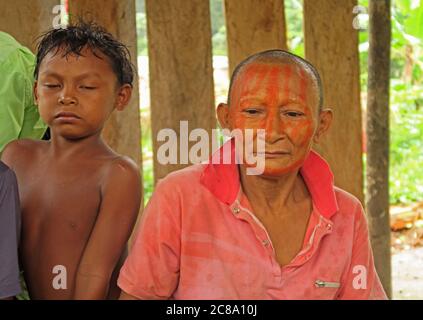 Nukak lady with traditional face paint and boy  Capricho, Guaviare Department; Colombia        November Stock Photo