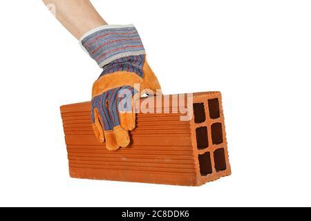 mano in guanto protettivo che posiziona un mattone Foto Stock