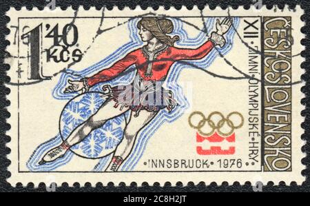 Francobollo. Pattinaggio femminile sui XII Giochi Olimpici di Innsbruck, Cecoslovacchia, 1976 Foto Stock