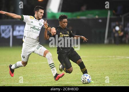 Orlando Florida USA . 23 luglio 2020. LAFC Midfielder Benedizione, Latif n° 7 lotta per tenere la palla durante il torneo MLS is Back all'ESPN Wild World of Sport di Orlando Florida USA. Foto: Marty Jean-Louis Foto Stock