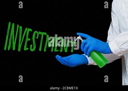 Scrittura a mano di testo scrittura investimento. Foto concettuale l'esborso di denaro di solito per reddito o profitto: Esborso di capitale visualizzazione di carta adesiva vuota Foto Stock