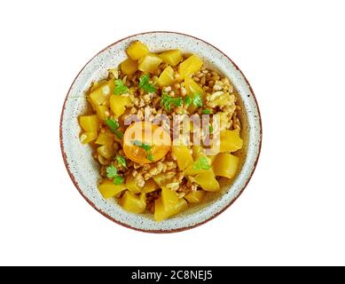 Farro Salad con Butternut e il pomodoro giallo primo piano Foto Stock