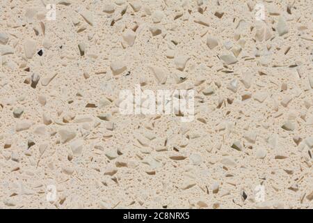 Rilievo impressionante fondo di pietra sintetica in tonalità beige. Foto Stock