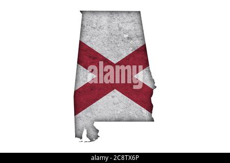 Mappa e bandiera dell'Alabama su cemento intemperato Foto Stock