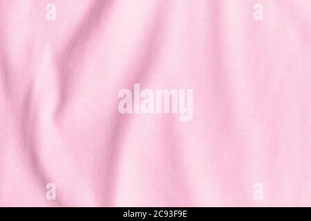 Texture e sfondo di tessuto rosa sminuzzato. Foto Stock