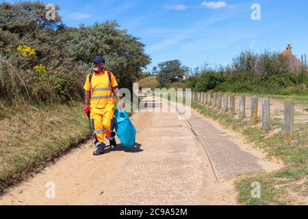 Pulitore di spiaggia, Camber Sands, east sussex, Regno Unito Foto Stock