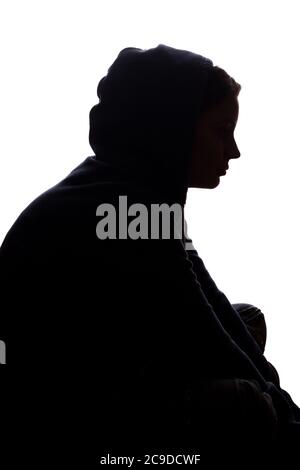 Giovane donna con dolore ha lasciato cadere le braccia - silhouette Foto Stock