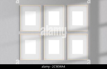 Sei cornici in legno su una parete mockup rendering 3d Foto Stock