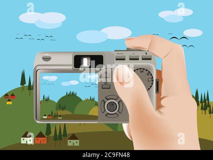 Immagine di una persona che tiene una fotocamera digitale e acquisisce natura Foto Stock