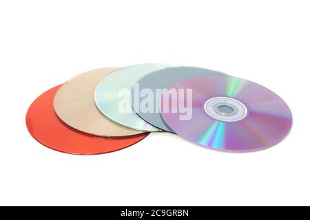 Diversi CD multicolore su sfondo bianco Foto Stock