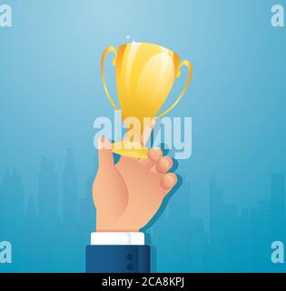 Coppa Gold Trophy tenuta a mano. Vincitore del premio trofeo Foto Stock