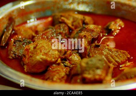 Ricetta piccante e gustosa di curry di pesce indiano. Foto Stock