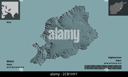 Forma di Khost, provincia dell'Afghanistan, e la sua capitale. Scala della distanza, anteprime ed etichette. Mappa di elevazione colorata. Rendering 3D Foto Stock