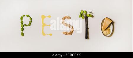 Ingredienti che formano pesto di parola su sfondo bianco semplice Foto Stock