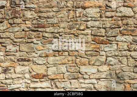 Primo piano del muro di mattoni di pietra. Motivo naturale ad alta risoluzione per lavori artistici di sfondo e design. Foto Stock