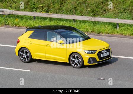 2019 Audi A1 S gialla linea 30 TFSI S-A; traffico veicolare veicoli in movimento, automobili che guidano veicoli su strade del Regno Unito, motori, motori sulla rete autostradale M6. Foto Stock