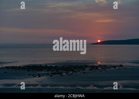 Tramonto sulla spiaggia a Port Logan, Dumfries e Galloway Foto Stock